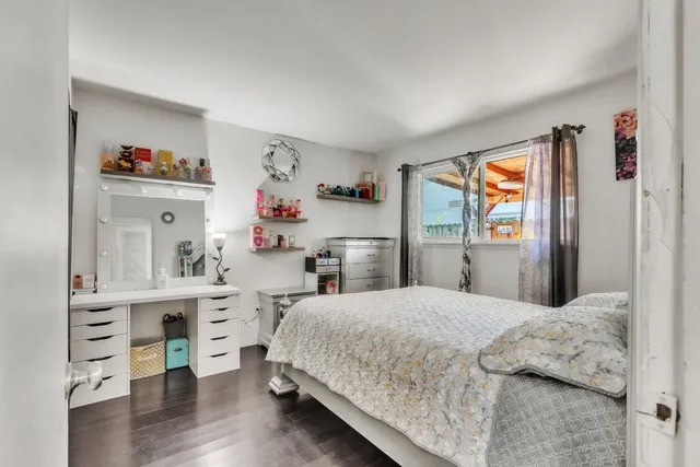 a bedroom with a bed and a cabinets