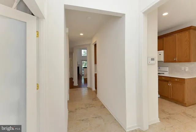 a view of a kitchen from the hallway