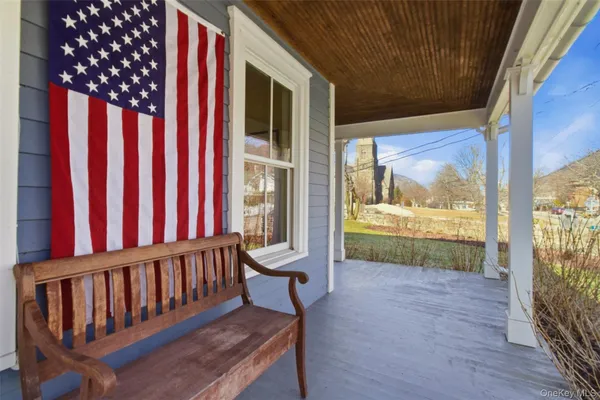 a view of porch with a furniture