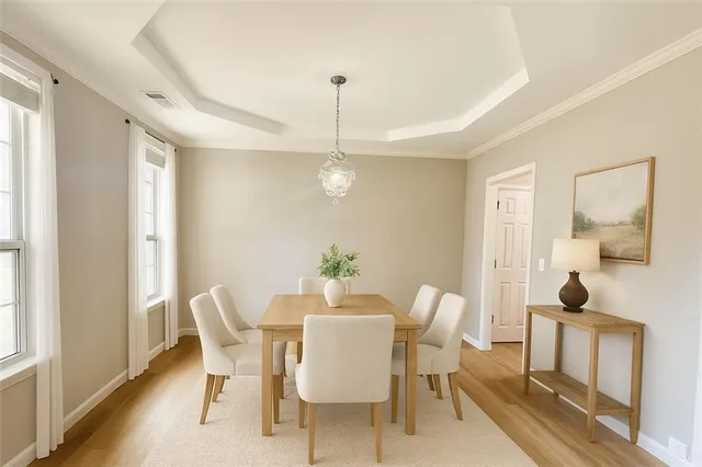 a view of an empty room and window and a kitchen