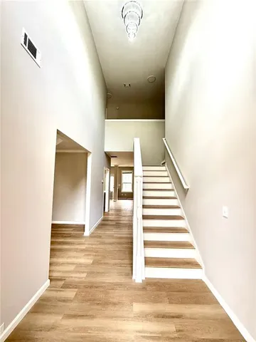 a view of an empty room and a window