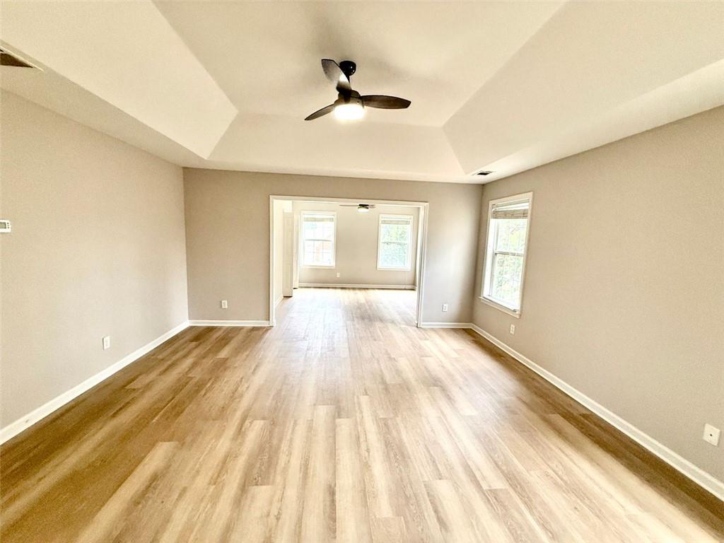 1505 Wedgefield Court Alpharetta, GA 30004 - Photo 24 of 61 a view of empty room with wooden floor and fan
