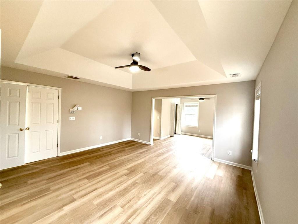 1505 Wedgefield Court Alpharetta, GA 30004 - Photo 25 of 61 a view of an empty room and window and a kitchen