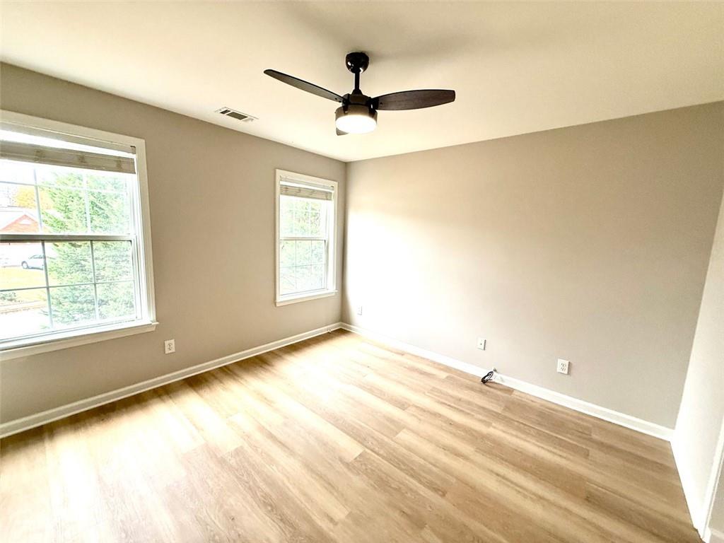 1505 Wedgefield Court Alpharetta, GA 30004 - Photo 31 of 61 a view of empty room with wooden floor and fan