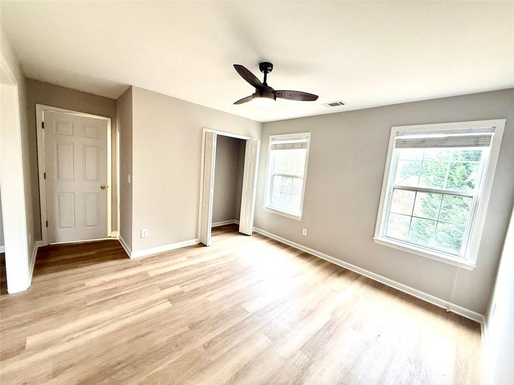1505 Wedgefield Court Alpharetta, GA 30004 - Photo 32 of 61 an empty room with windows and closet