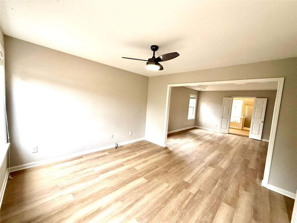 1505 Wedgefield Court Alpharetta, GA 30004 - Photo 33 of 61 a view of empty room with wooden floor and fan