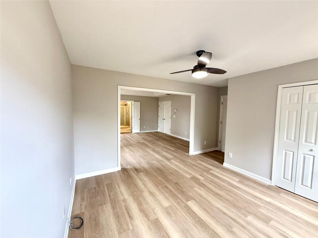 1505 Wedgefield Court Alpharetta, GA 30004 - Photo 35 of 61 a view of an empty room and window and ceiling fan