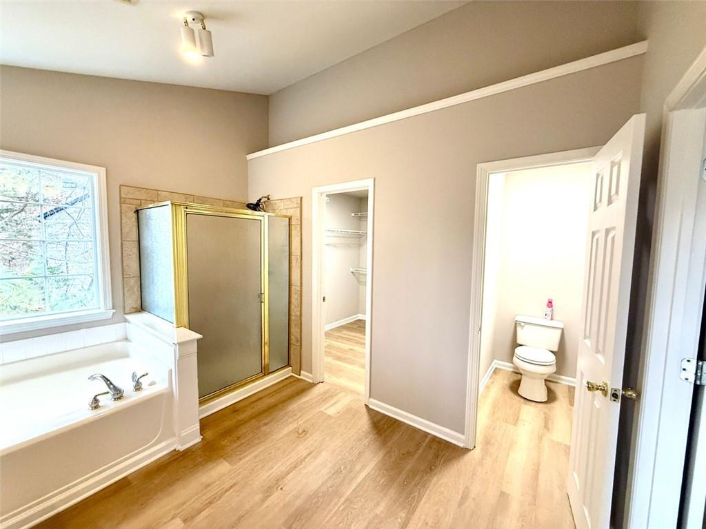 1505 Wedgefield Court Alpharetta, GA 30004 - Photo 37 of 61 a bathroom with a tub and shower