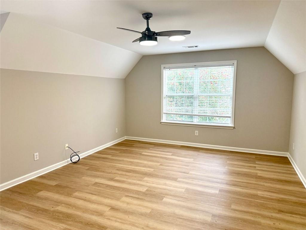 1505 Wedgefield Court Alpharetta, GA 30004 - Photo 42 of 61 wooden floor in an empty room with a window