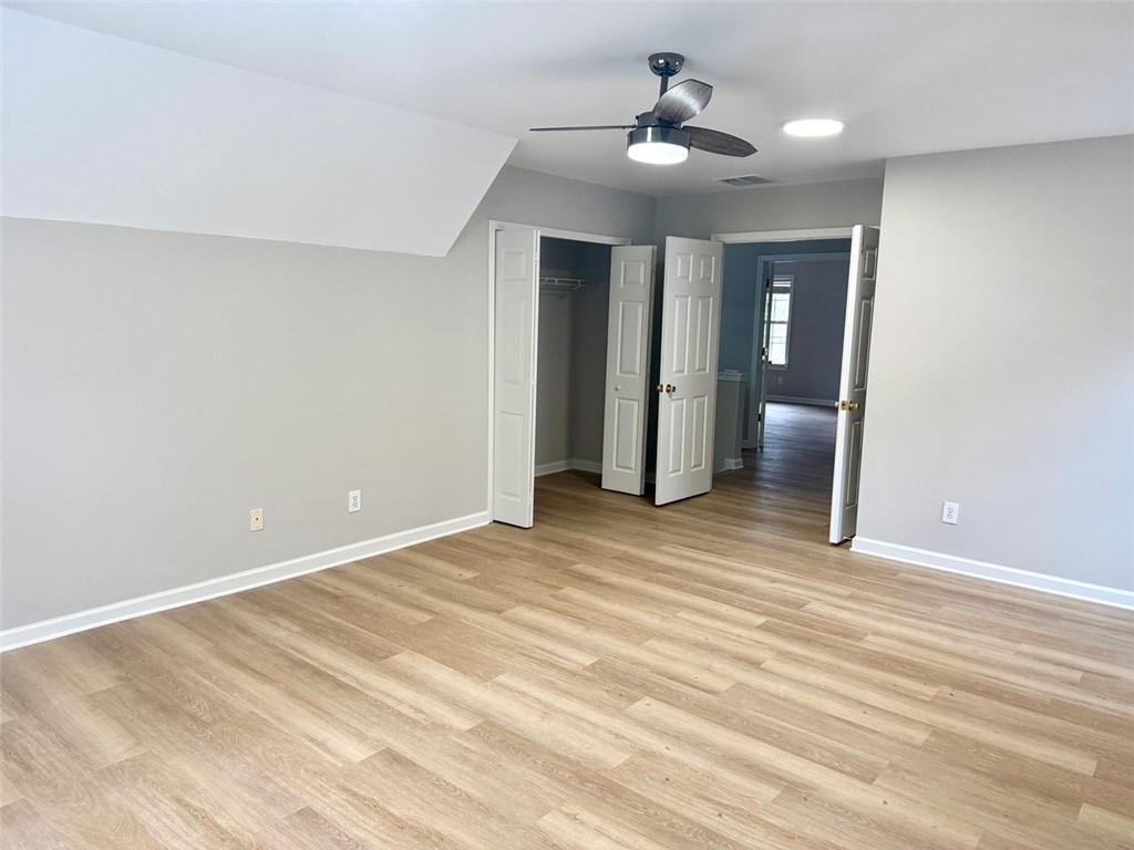 1505 Wedgefield Court Alpharetta, GA 30004 - Photo 44 of 61 a view of an empty room with window and wooden floor