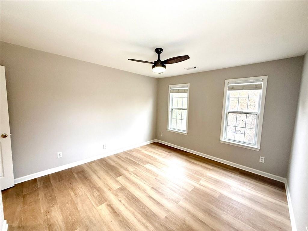 1505 Wedgefield Court Alpharetta, GA 30004 - Photo 47 of 61 wooden floor in an empty room with a window