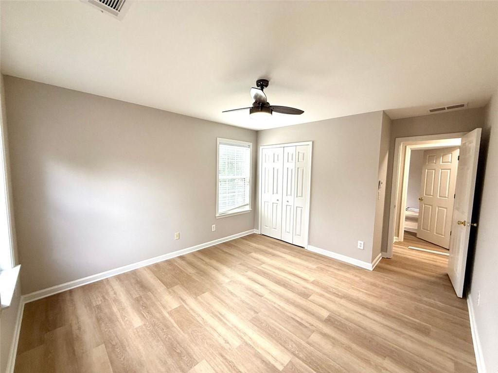 1505 Wedgefield Court Alpharetta, GA 30004 - Photo 48 of 61 a view of an empty room with window and wooden floor