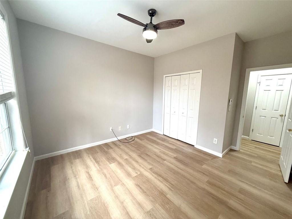 1505 Wedgefield Court Alpharetta, GA 30004 - Photo 54 of 61 a view of empty room with wooden floor and fan