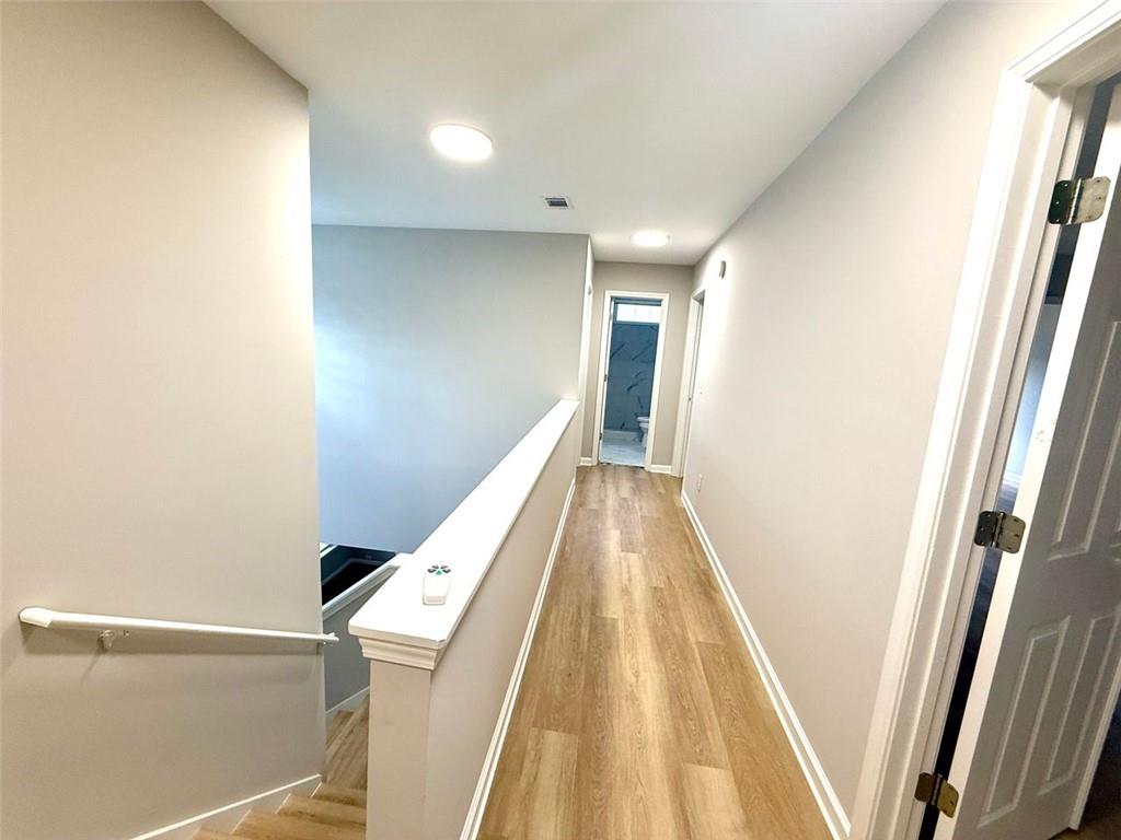 1505 Wedgefield Court Alpharetta, GA 30004 - Photo 57 of 61 a view of hallway with stairs