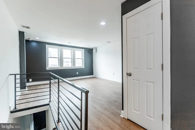 a view of a kitchen cabinets and wooden floor