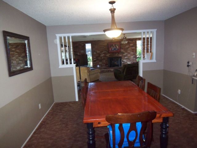 1140 Harpole Road Redding, CA 96002 - Photo 5 of 15 a view of a dining room with furniture window and wooden floor