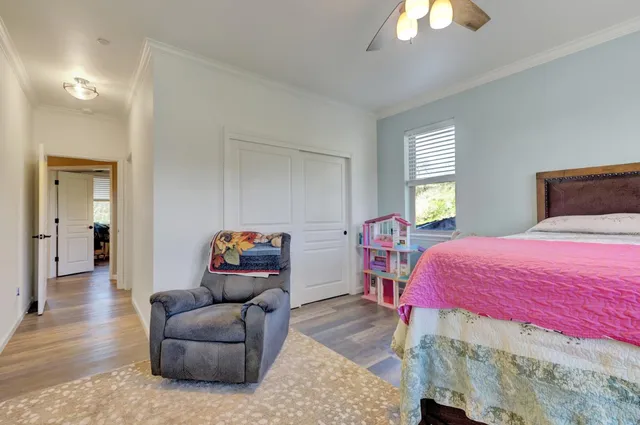 a bed room with a bed and a window