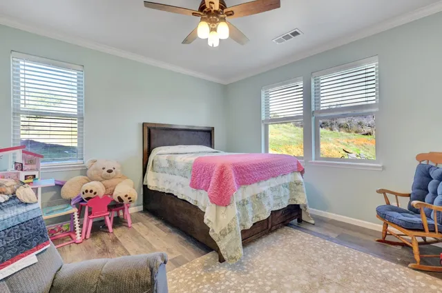 a bathroom with a toilet a sink and shower