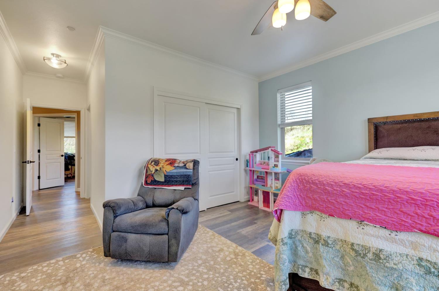 6718 Cross Star Trail Loma Rica, CA 95901 - Photo 13 of 54 a bedroom with a bed and wooden floor