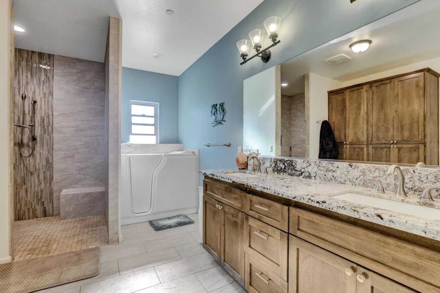 6718 Cross Star Trail Loma Rica, CA 95901 - Photo 21 of 54 a bathroom with a double vanity sink and a mirror