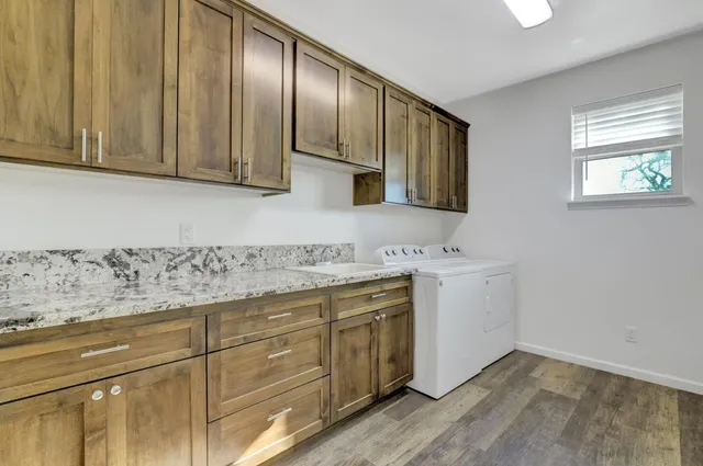 a view of a patio with table and chairs
