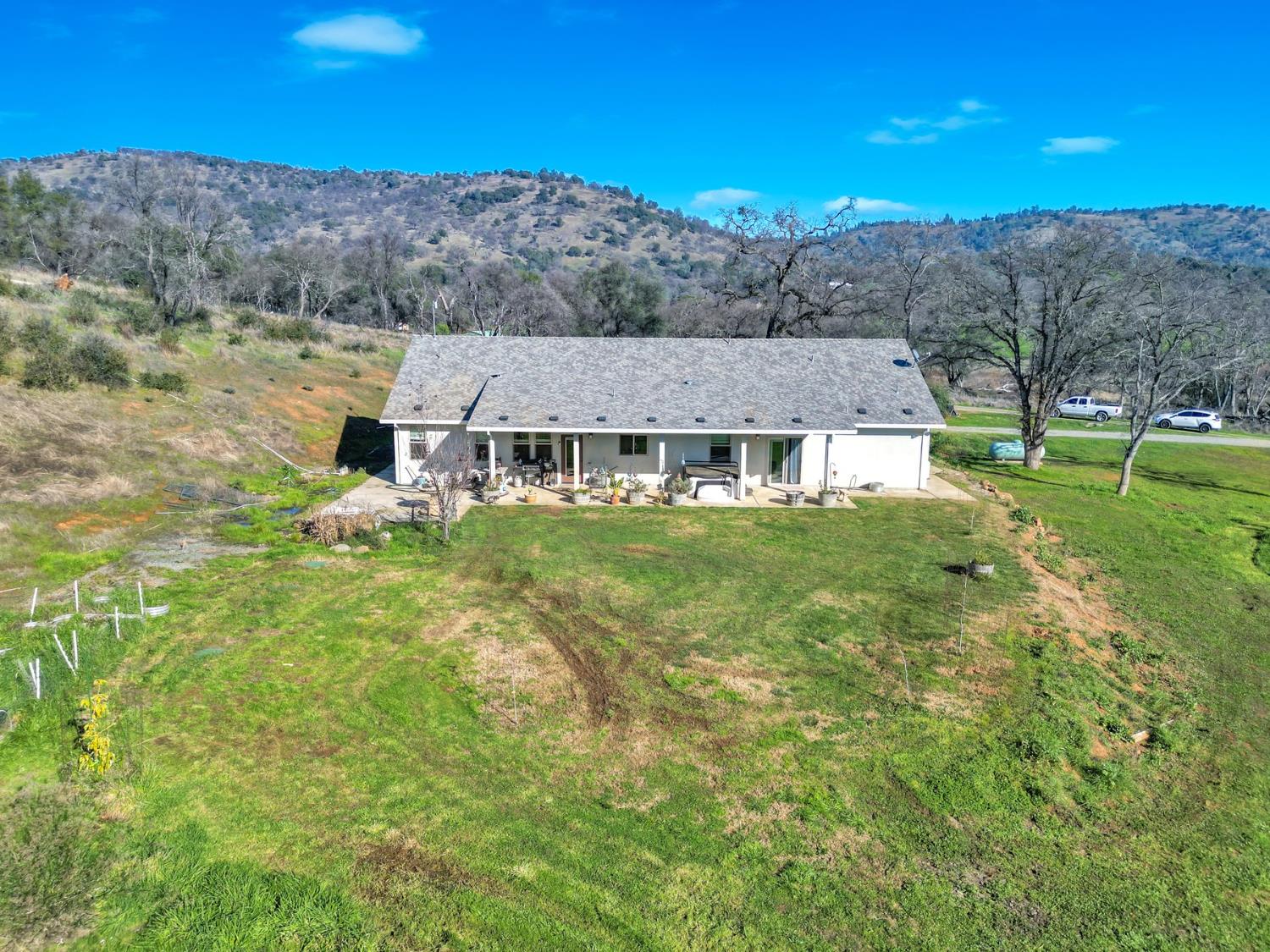 6718 Cross Star Trail Loma Rica, CA 95901 - Photo 3 of 54 a view of house with a big yard