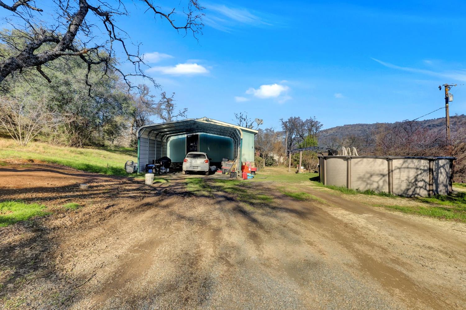 6718 Cross Star Trail Loma Rica, CA 95901 - Photo 35 of 54 a view of a house with a yard and sitting area