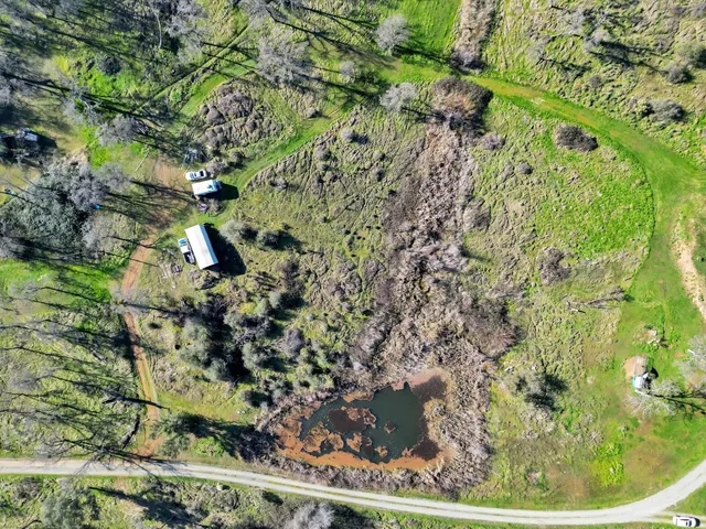 a view of a swimming pool and a yard