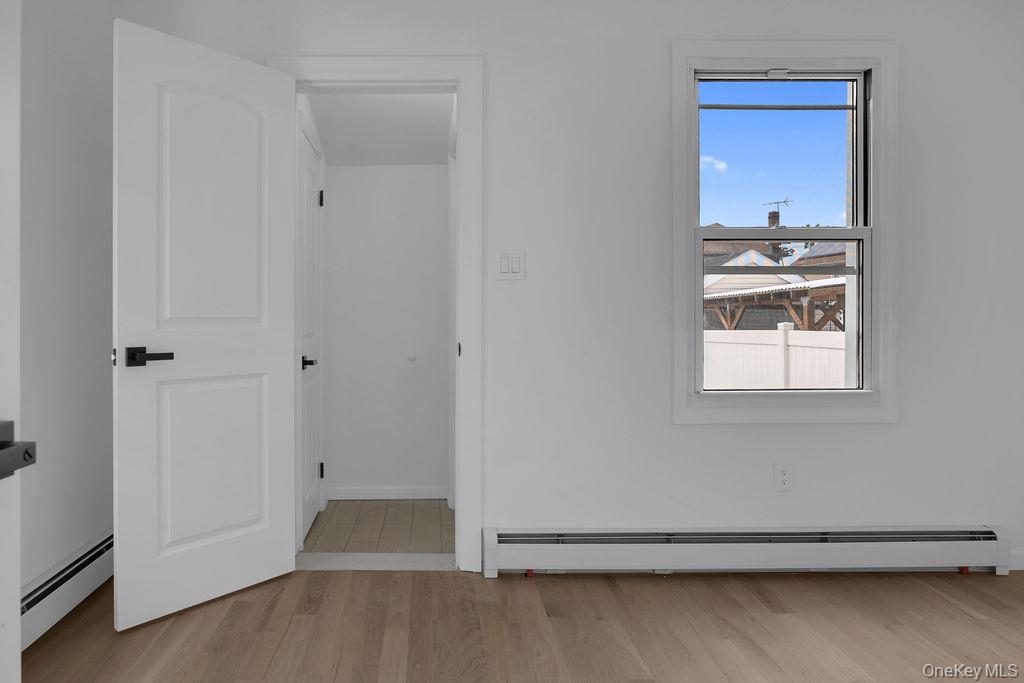 173-62 103rd Road Queens, NY 11433 - Photo 17 of 23 a view of an empty room