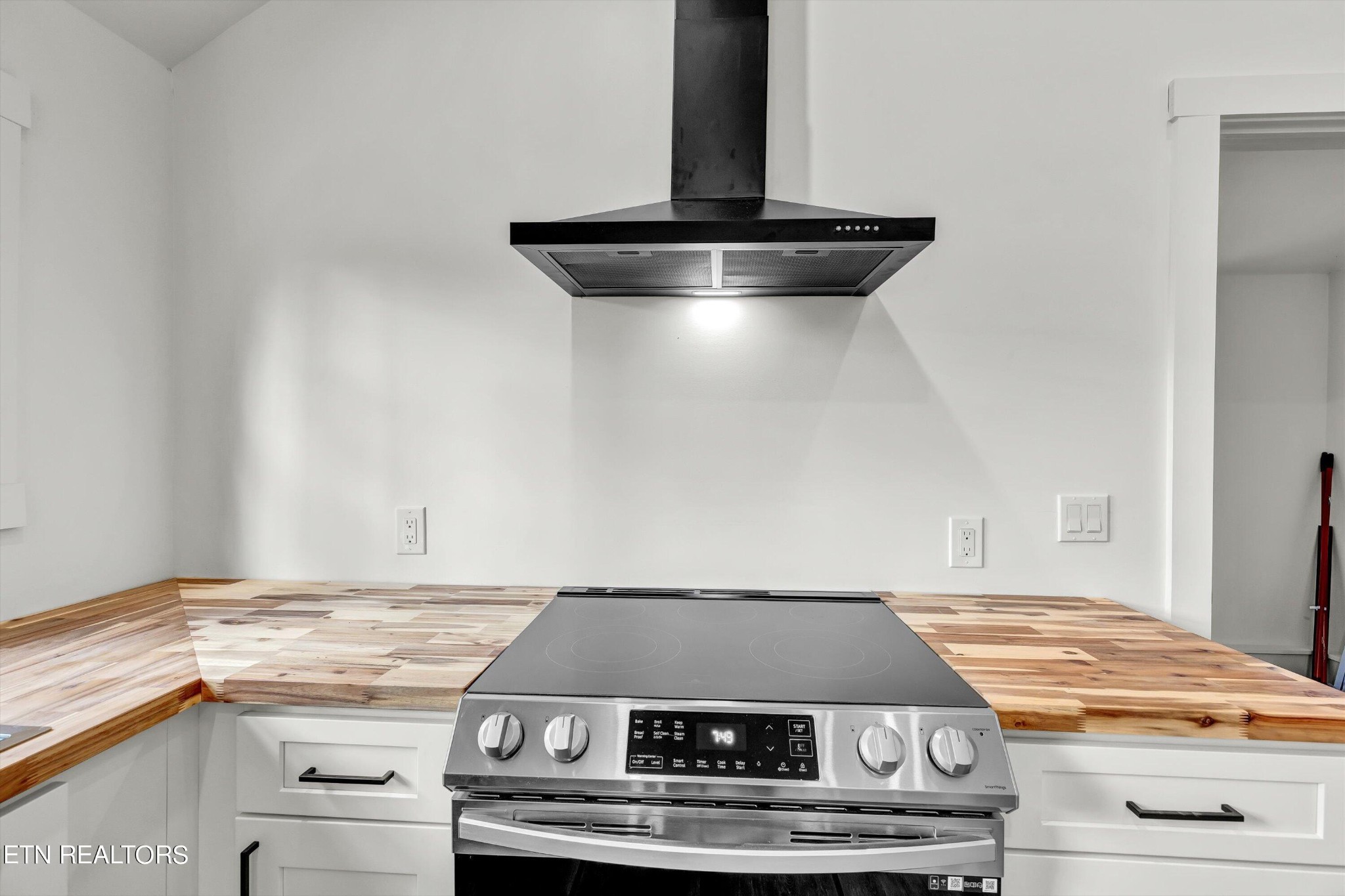 2209 Belt Road Knoxville, TN 37920 - Photo 16 of 36 a stove top oven sitting inside of a kitchen