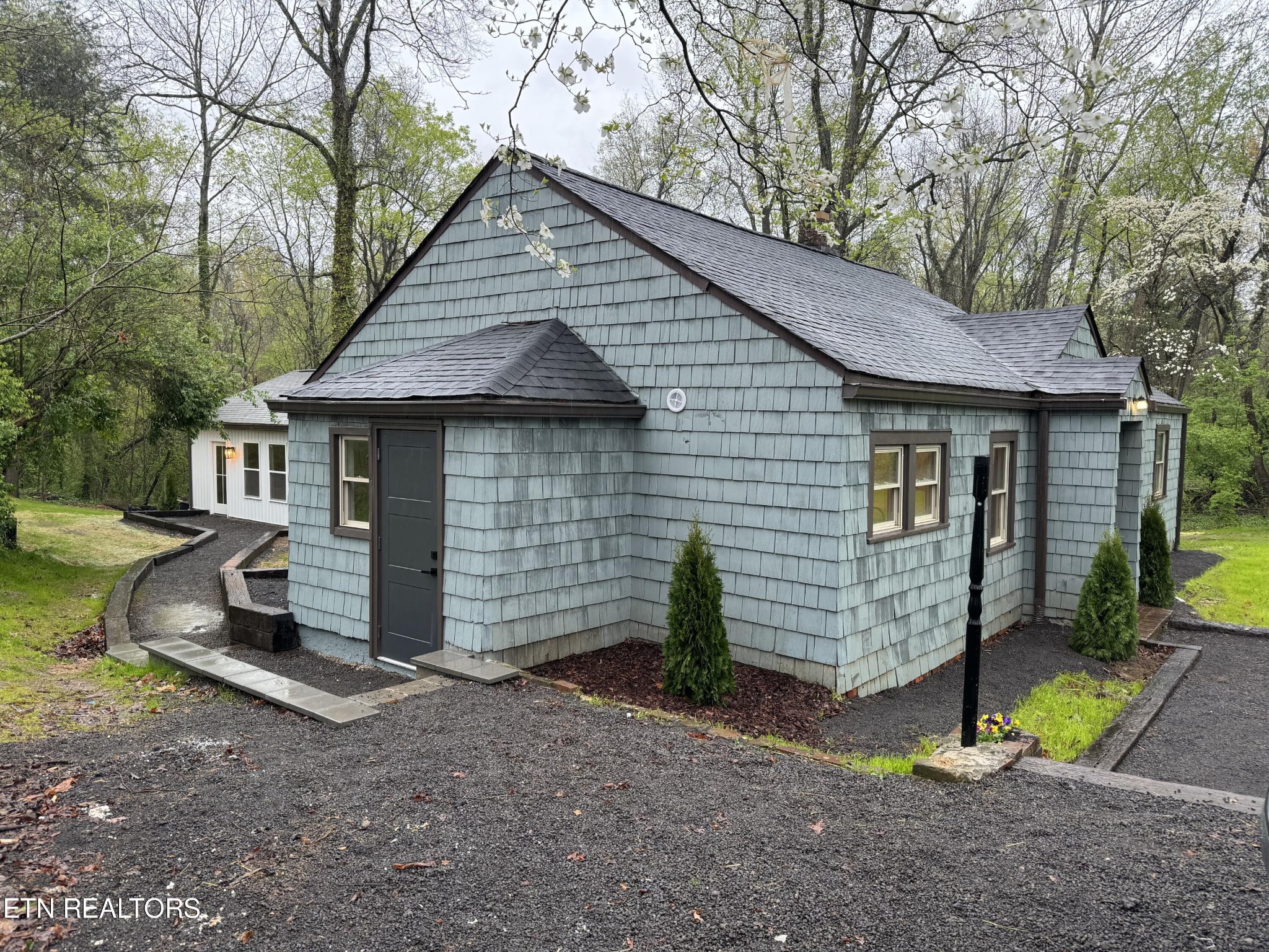 2209 Belt Road Knoxville, TN 37920 - Photo 2 of 36 a view of a small house with a yard and large tree