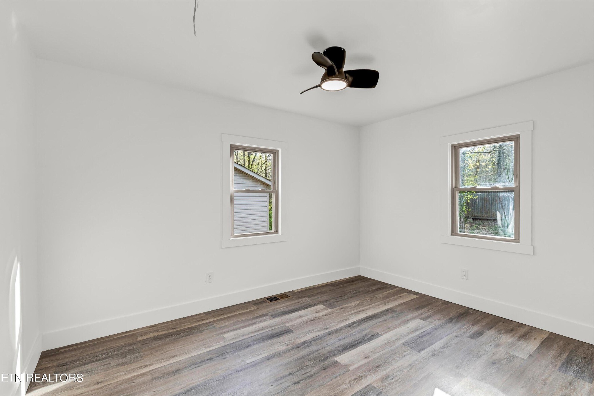 2209 Belt Road Knoxville, TN 37920 - Photo 23 of 36 an empty room with a window and a ceiling fan