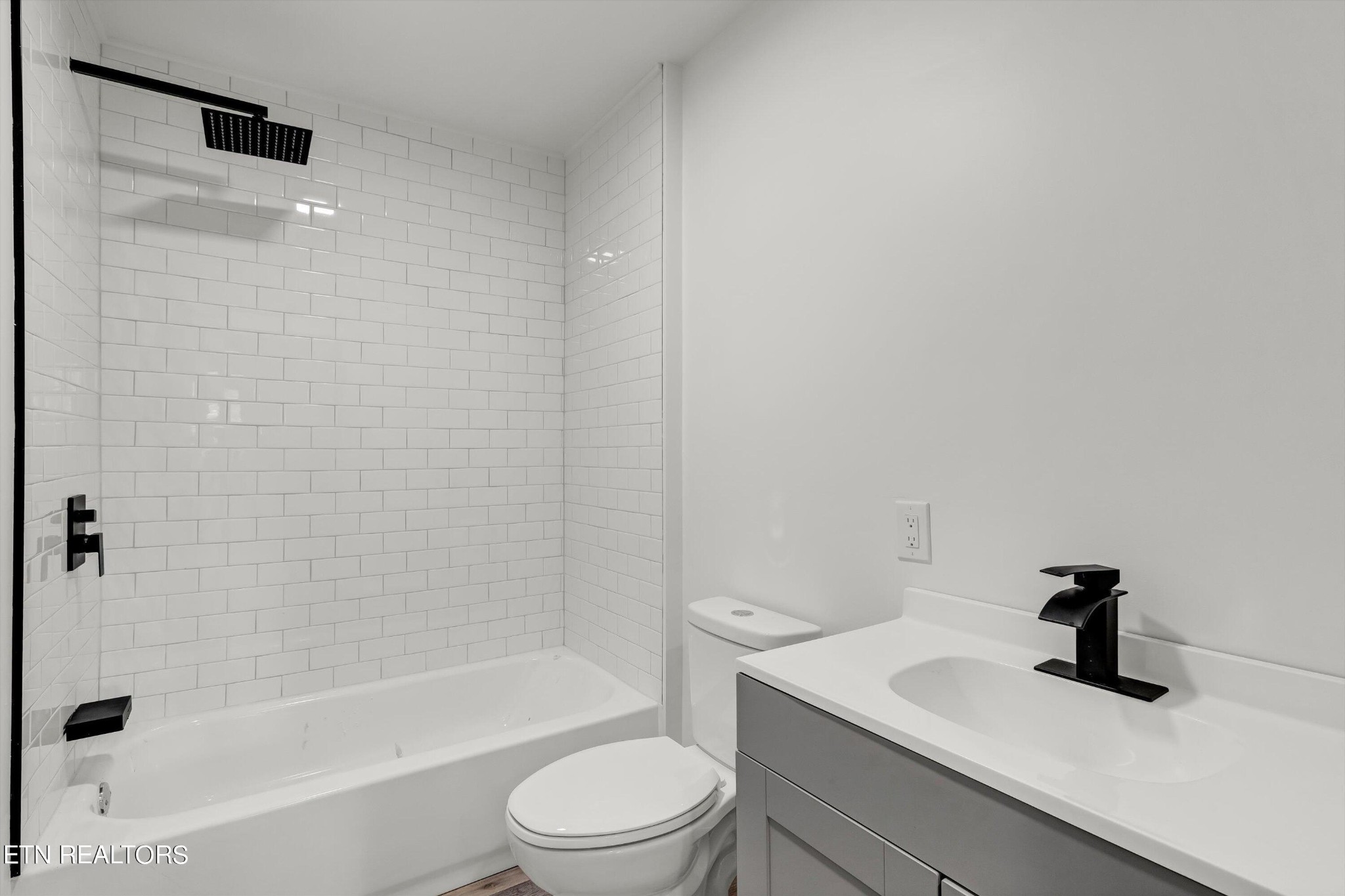 2209 Belt Road Knoxville, TN 37920 - Photo 25 of 36 a bathroom with a sink a toilet and a bathtub