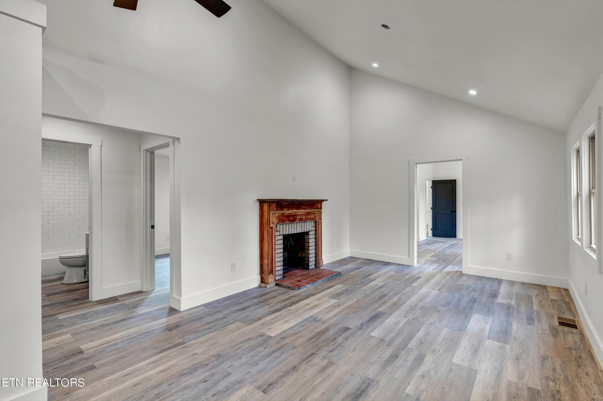 2209 Belt Road Knoxville, TN 37920 - Photo 10 of 36 a view of an empty room with wooden floor and a window
