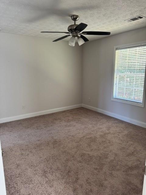 25 Jefferson Walk Circle Jefferson, GA 30549 - Photo 15 of 16 a view of a room with a window and a ceiling fan