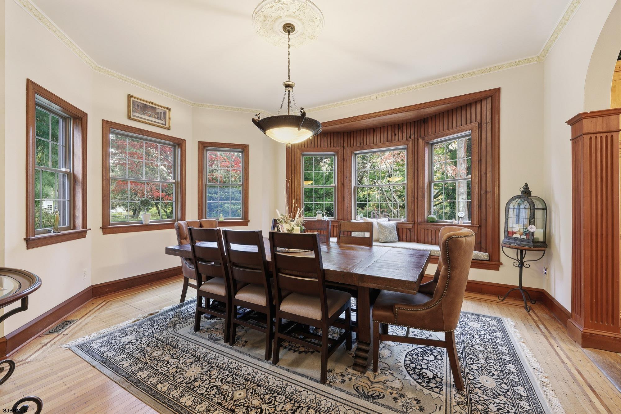 1202 Shore Road Northfield, NJ 08225 - Photo 18 of 57 a view of a dining room with furniture window and wooden floor