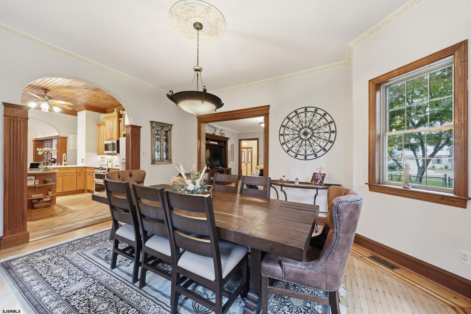 1202 Shore Road Northfield, NJ 08225 - Photo 19 of 57 a view of a dining room with furniture window and wooden floor