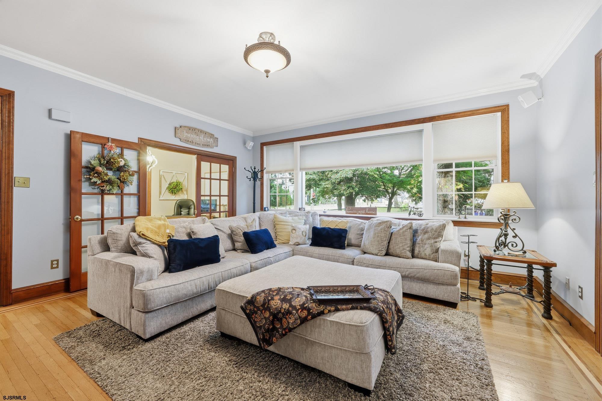 1202 Shore Road Northfield, NJ 08225 - Photo 22 of 57 a living room with furniture and a large window