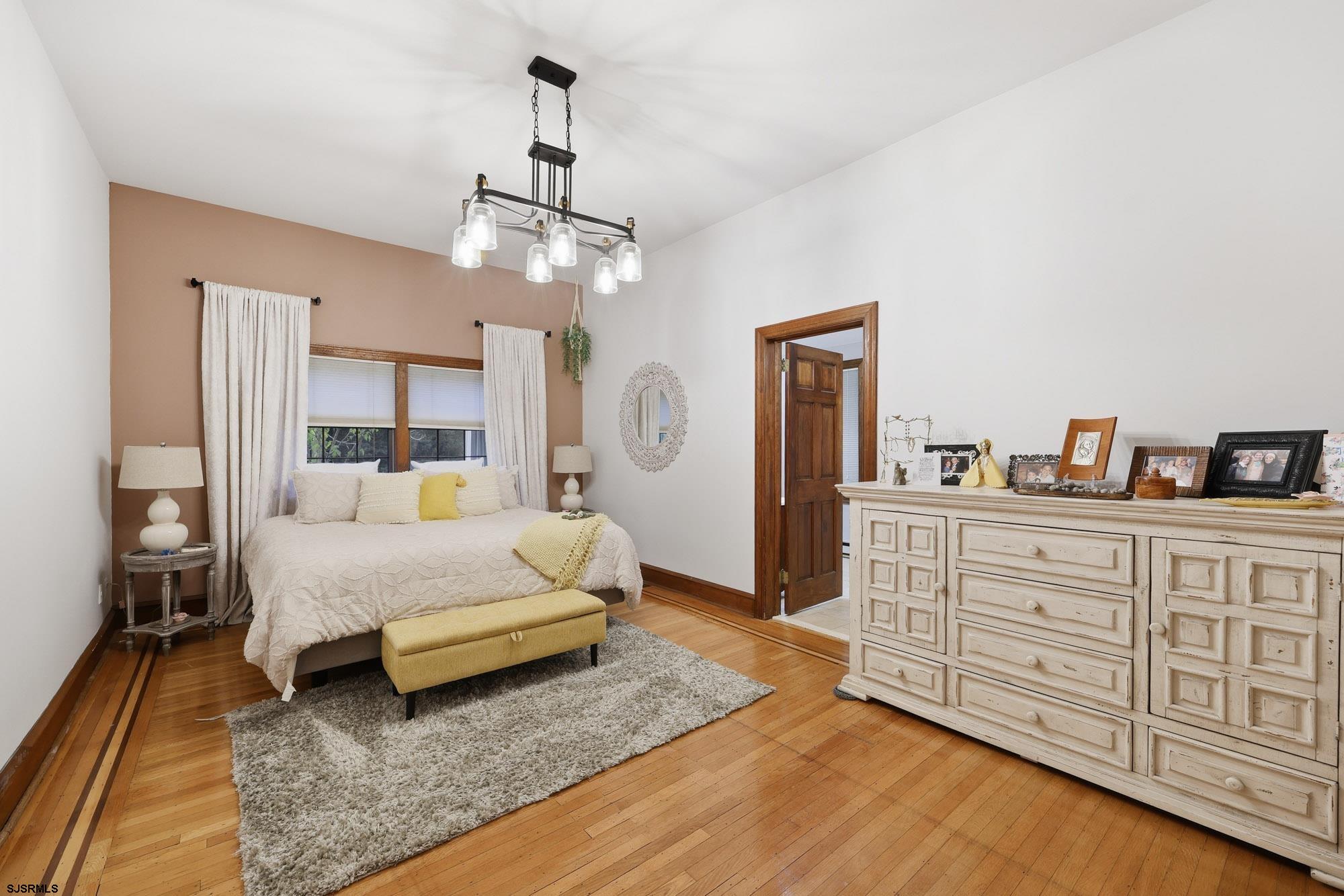 1202 Shore Road Northfield, NJ 08225 - Photo 26 of 57 a spacious bedroom with a large bed and a dresser