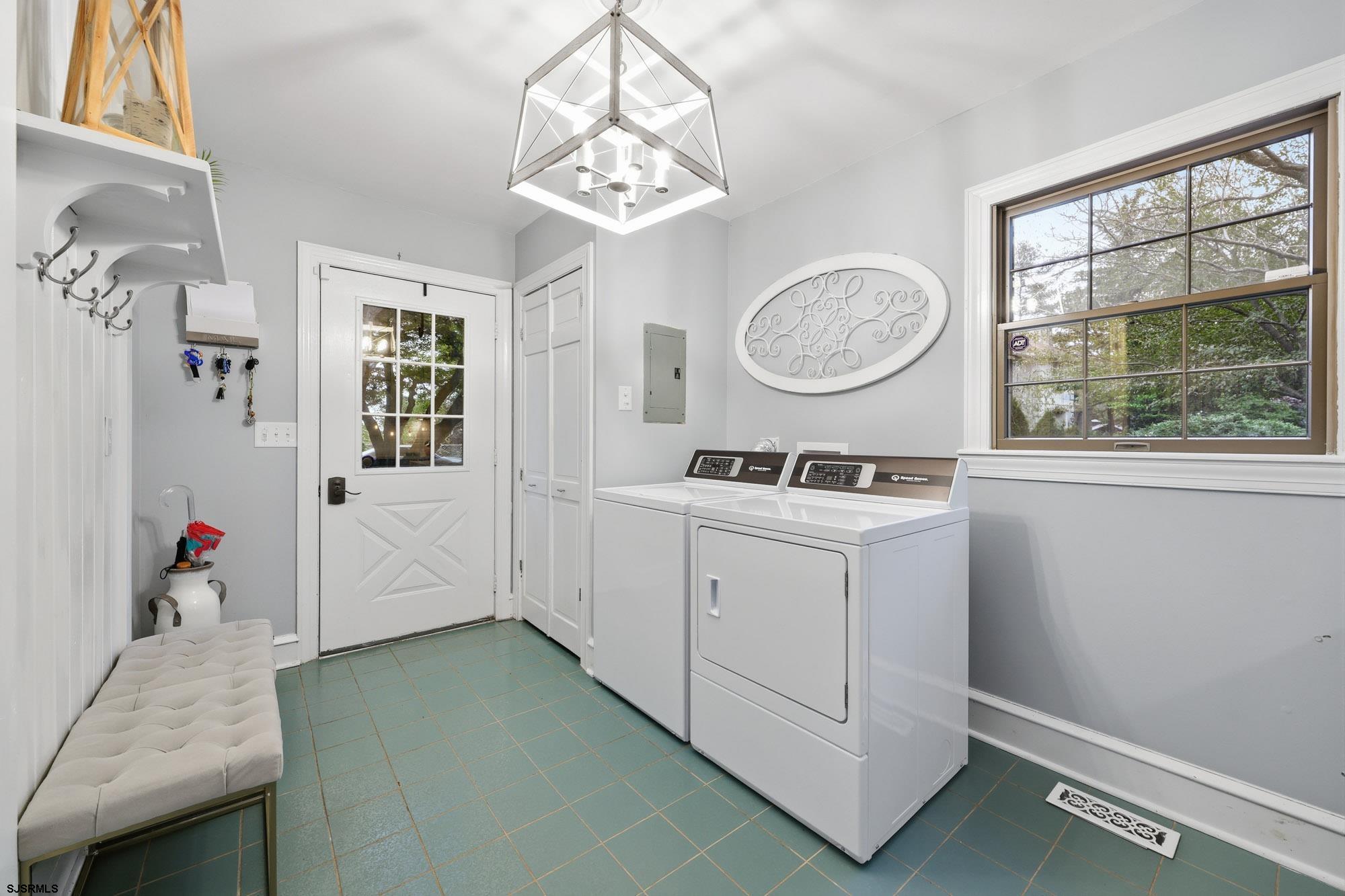 1202 Shore Road Northfield, NJ 08225 - Photo 31 of 57 a bathroom with a sink a mirror and a window