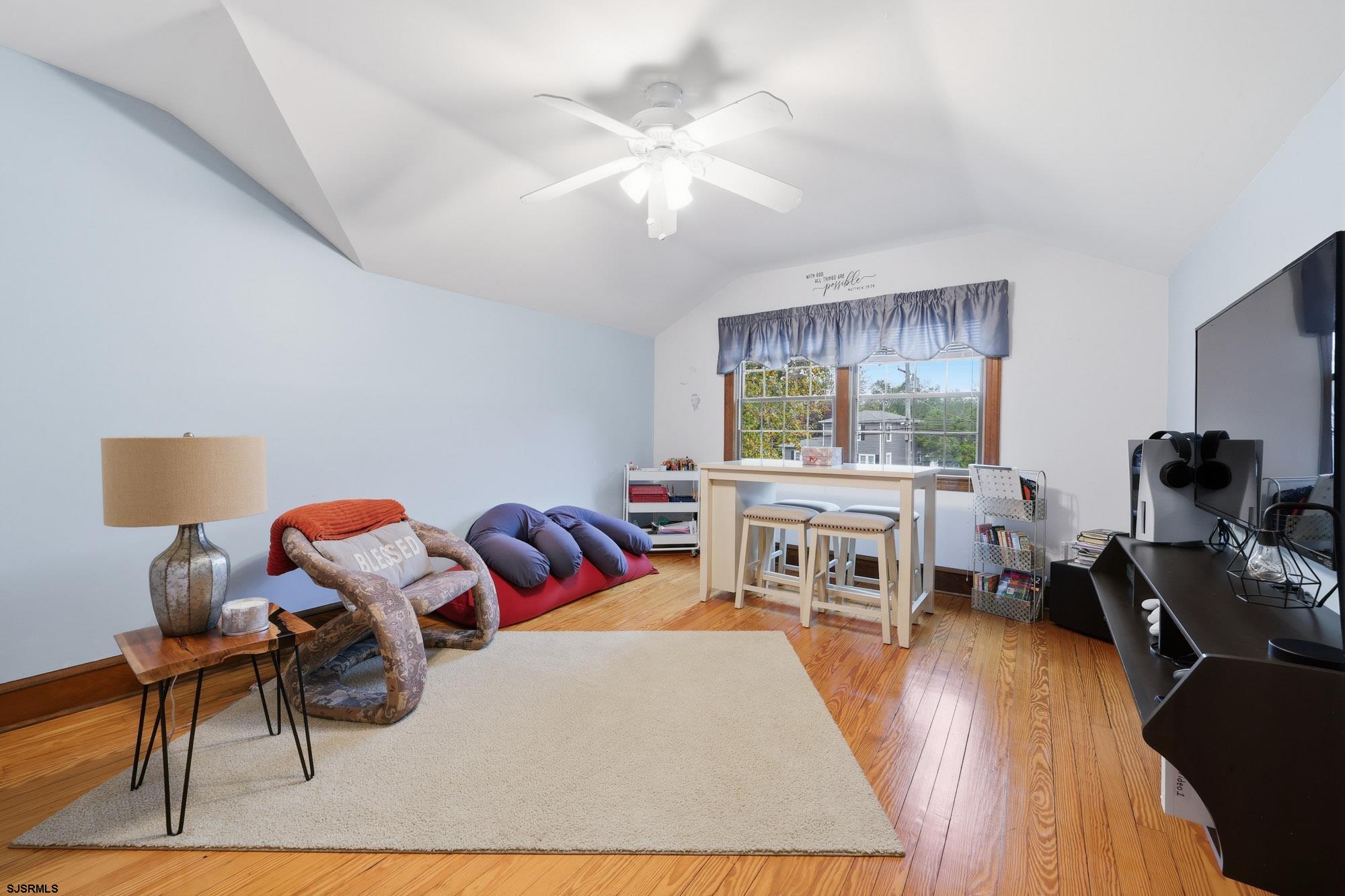 1202 Shore Road Northfield, NJ 08225 - Photo 35 of 57 a living room with furniture and a flat screen tv