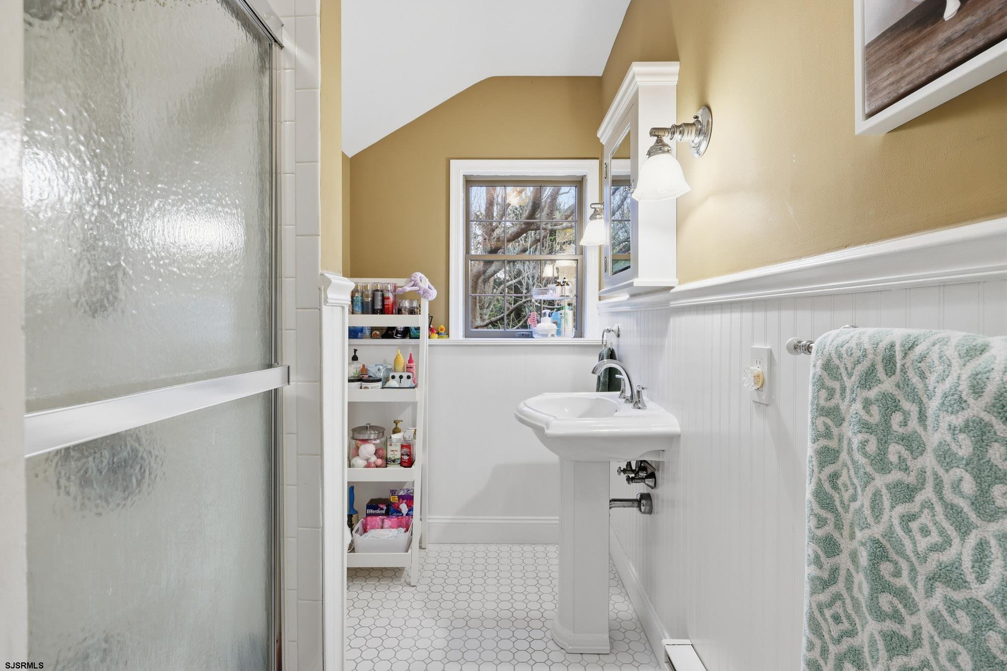 1202 Shore Road Northfield, NJ 08225 - Photo 37 of 57 a bathroom with a sink and a mirror