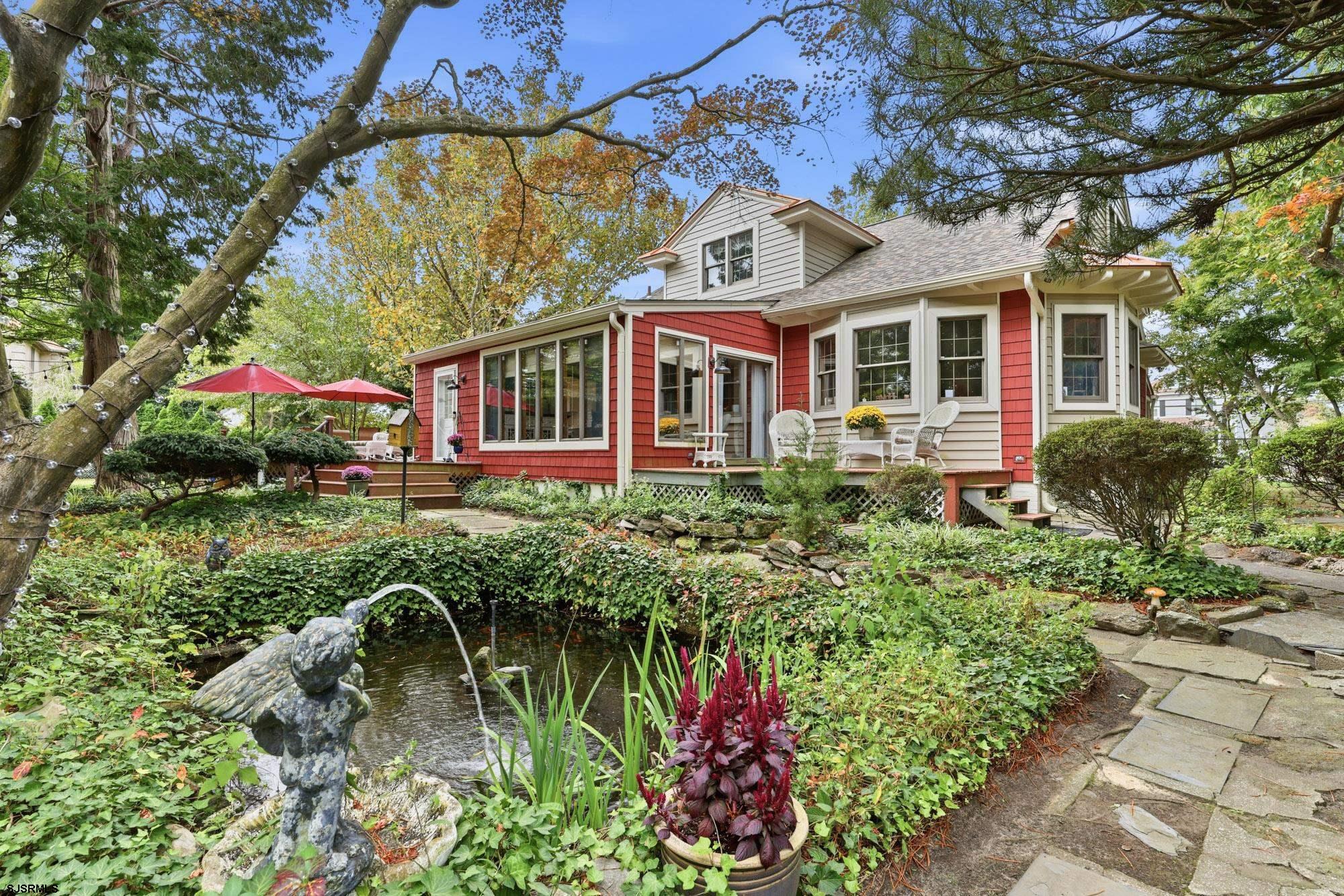 1202 Shore Road Northfield, NJ 08225 - Photo 4 of 57 a front view of a house with a garden