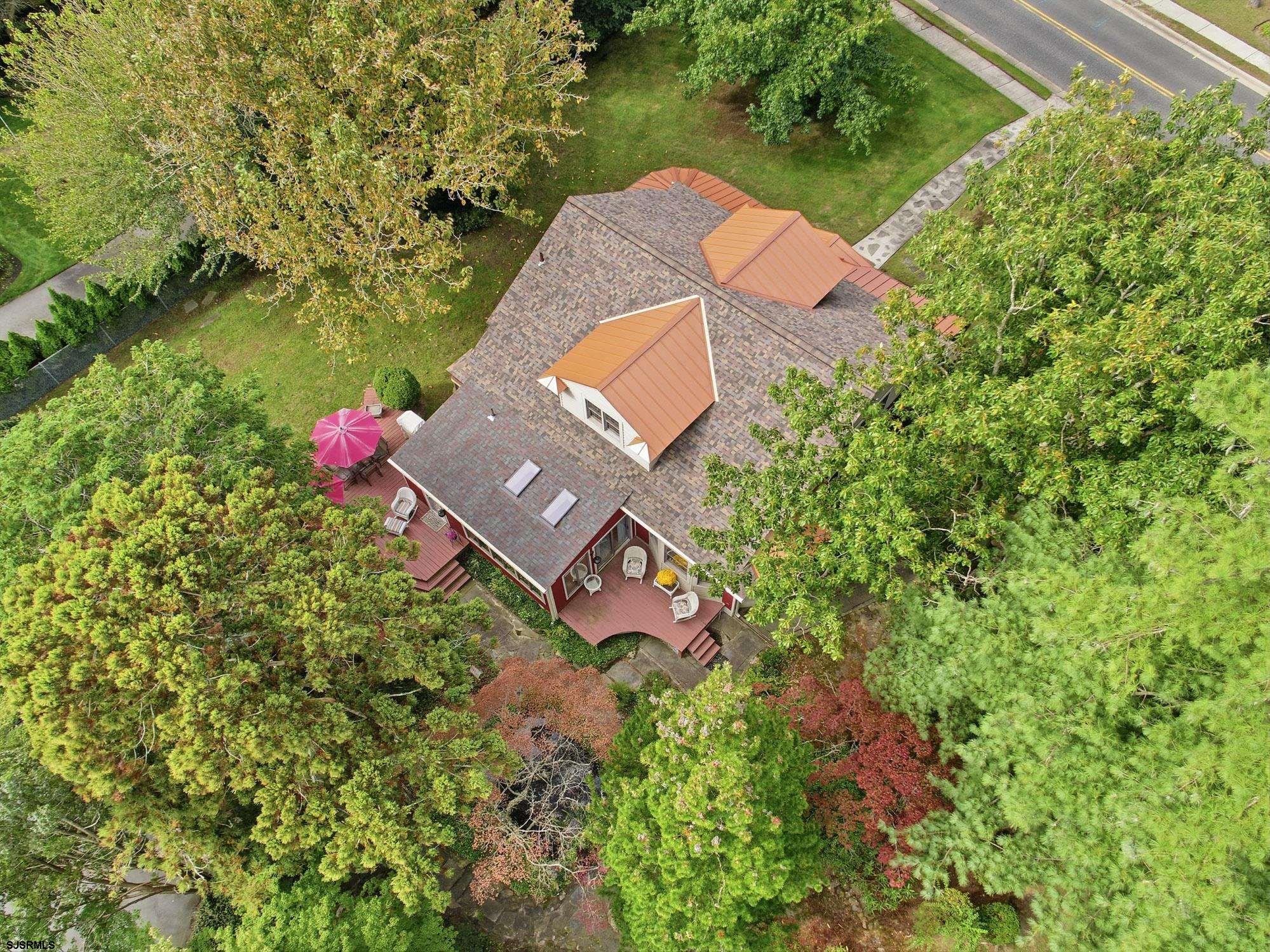 1202 Shore Road Northfield, NJ 08225 - Photo 49 of 57 an aerial view of a house with a yard and a lake view