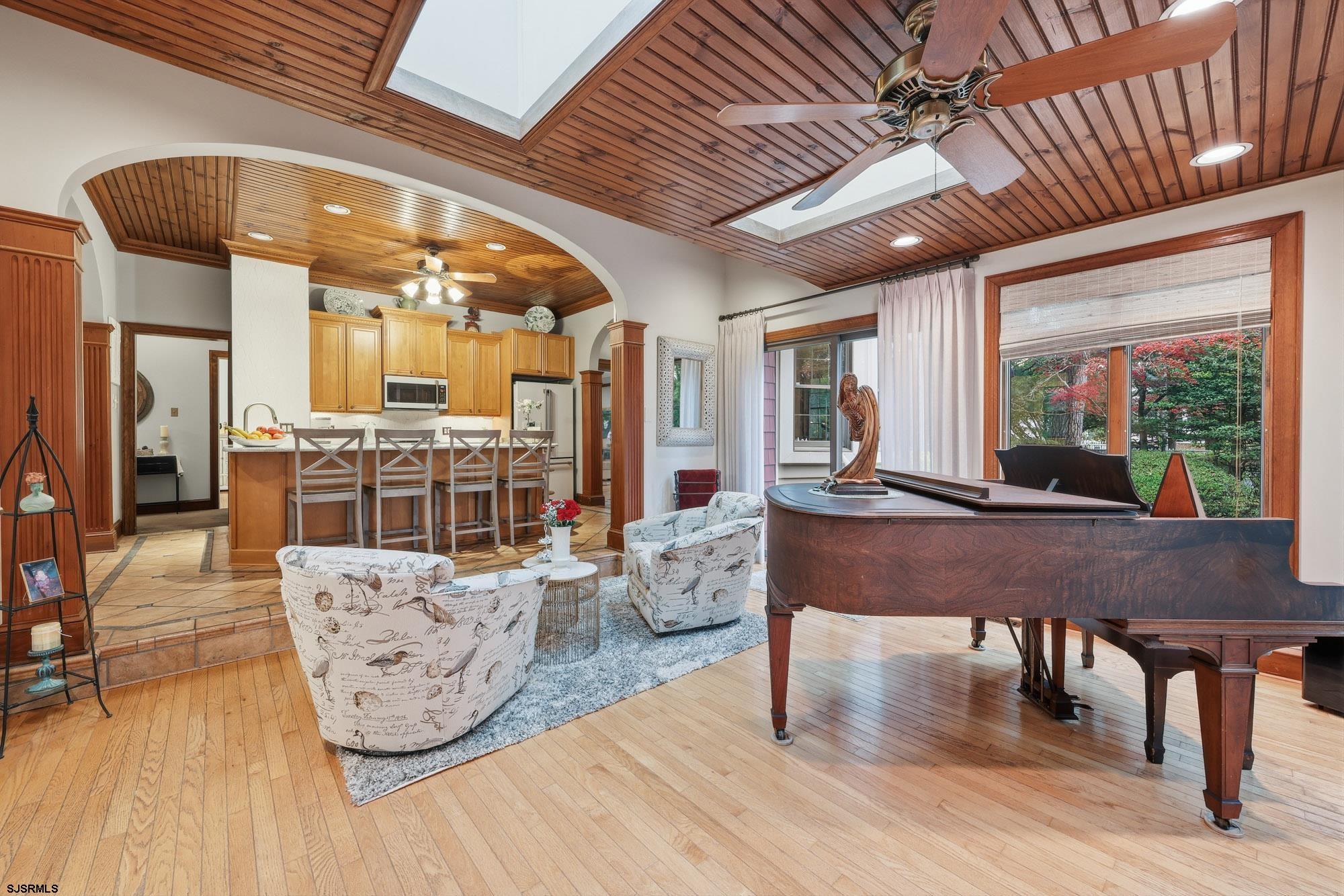 1202 Shore Road Northfield, NJ 08225 - Photo 10 of 57 a living room with furniture a table and wooden floor