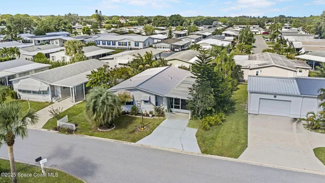 an aerial view of residential house with outdoor space
