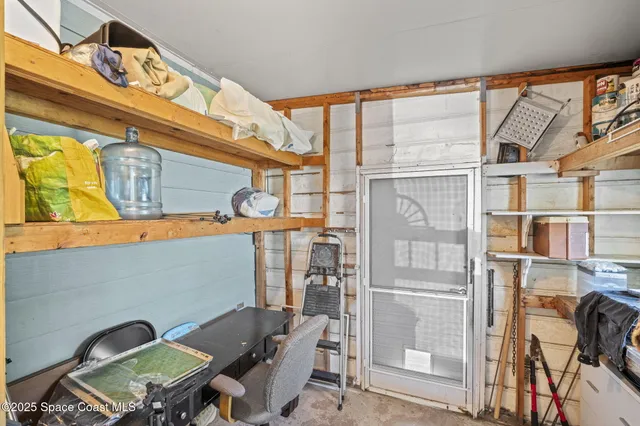 a view of a chairs and table in a room