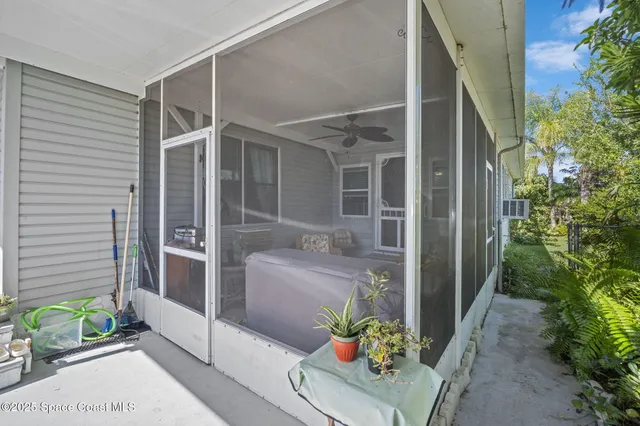 a front view of a house with outdoor seating