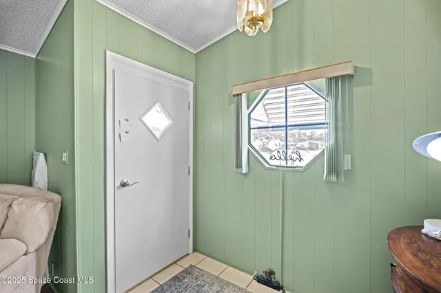 a bathroom with a window and a shower