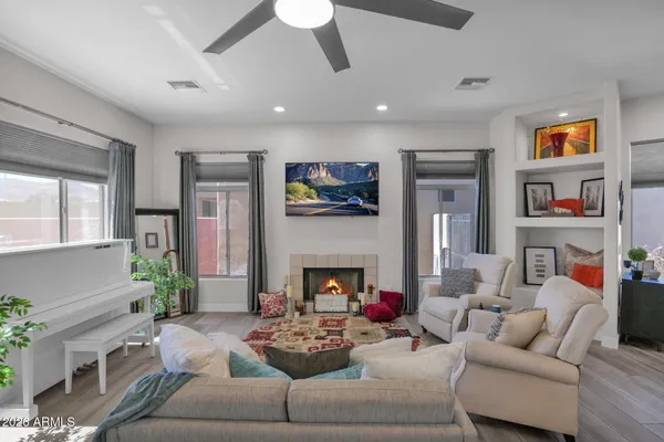 a living room with furniture and a fireplace